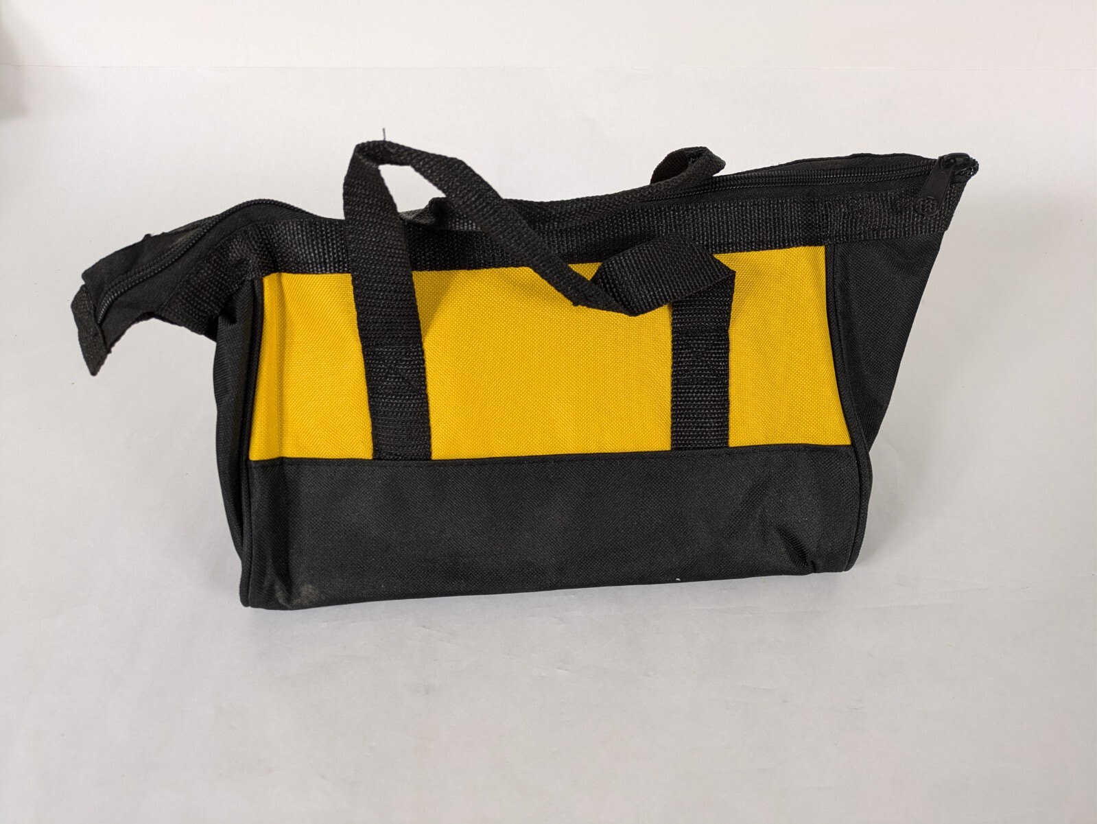 Small DeWalt Branded Tool Bag/ 11x9x7 inches tall/ triangular profile/ zipper