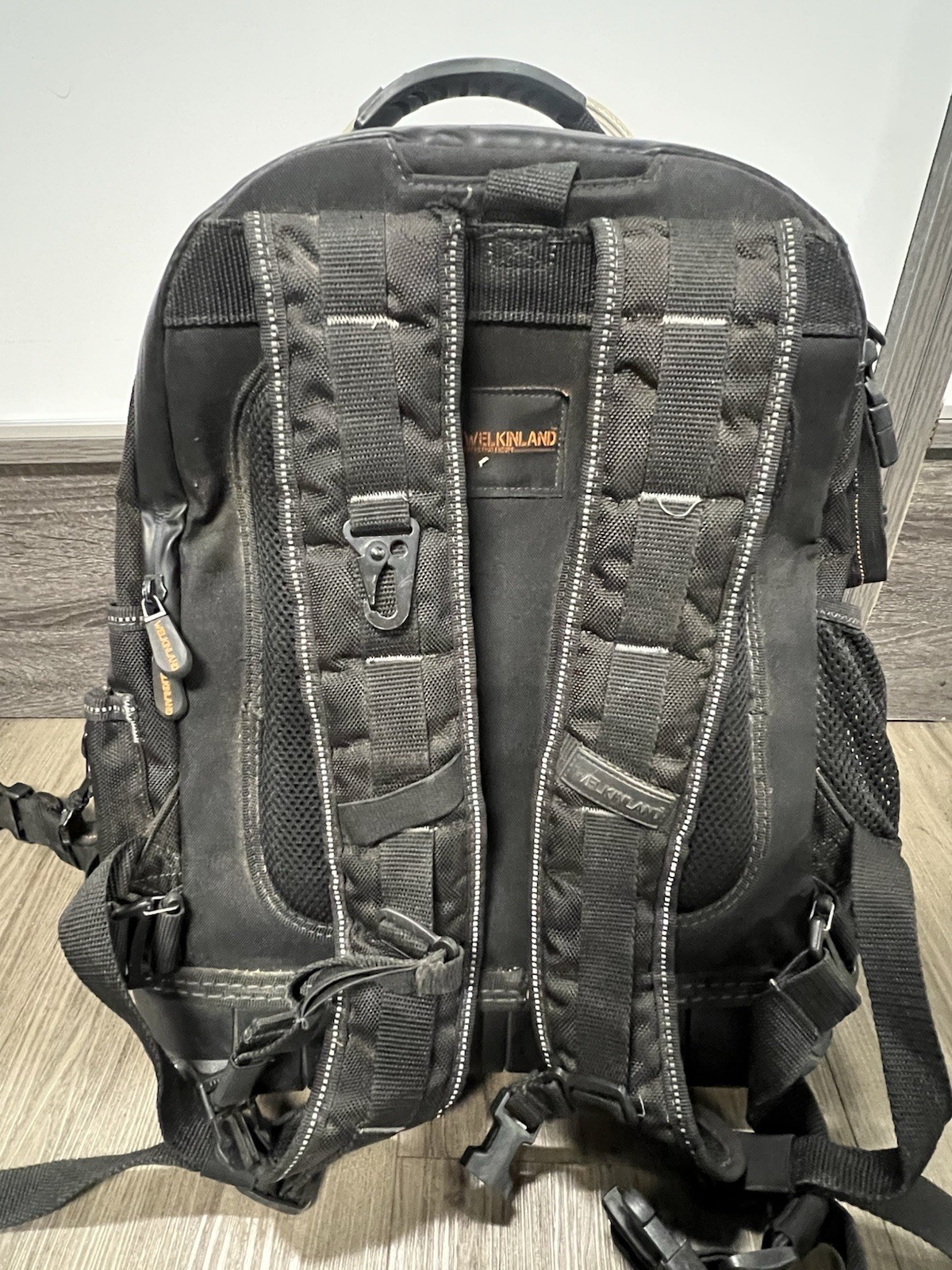 WELKINLAND 77 Pocket Large Tool Backpack Black/Orange Molded Base, Padded Handle