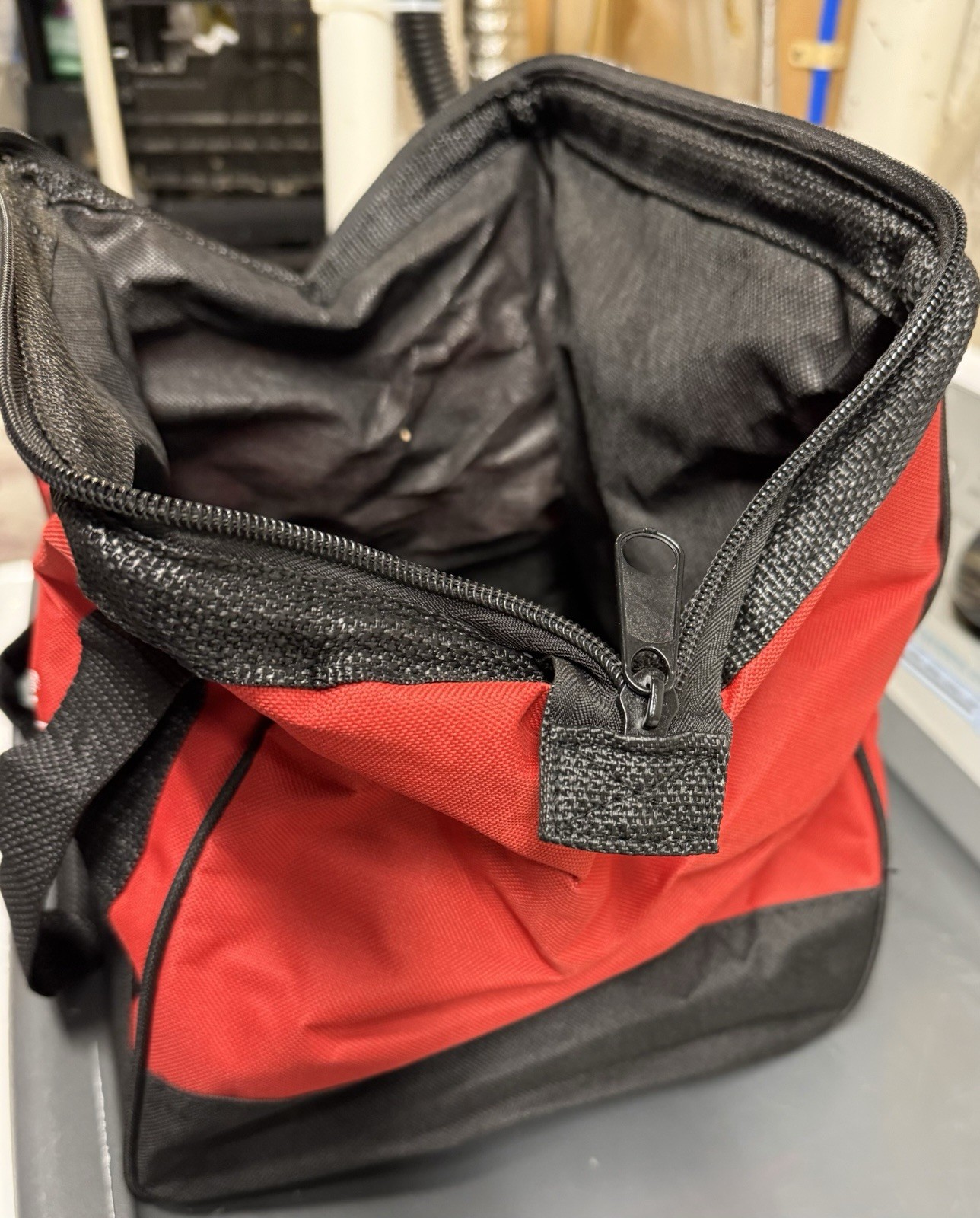 Milwaukee Red and Black Fabric Tool Bag with Handle and Zipper Closure